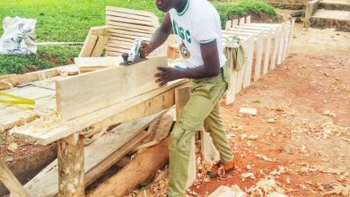 Photo of NIGERIANS COMMEND CORPS MEMBER WHO USED HIS CARPENTRY SKILL TO CONSTRUCT DESKS FOR HIS STUDENTS AT NO COST